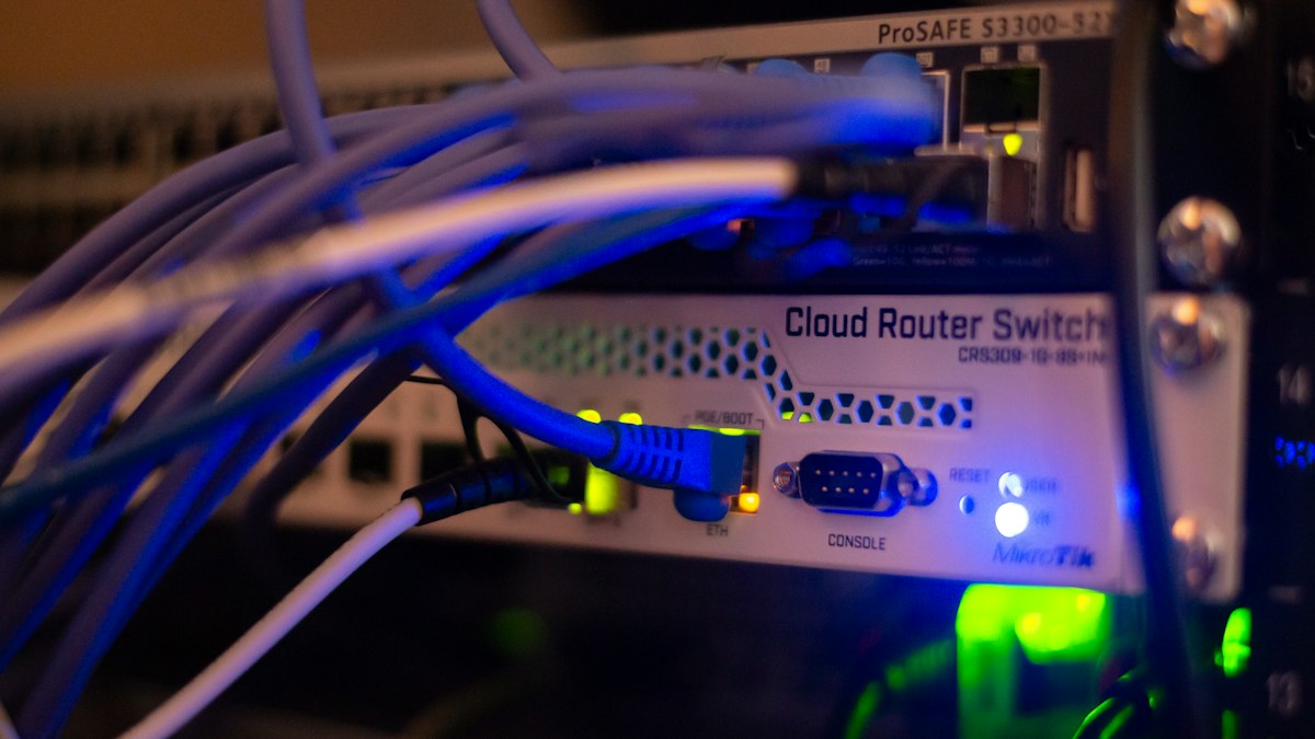 Close-up of network server cables representing CI/CD deployment infrastructure